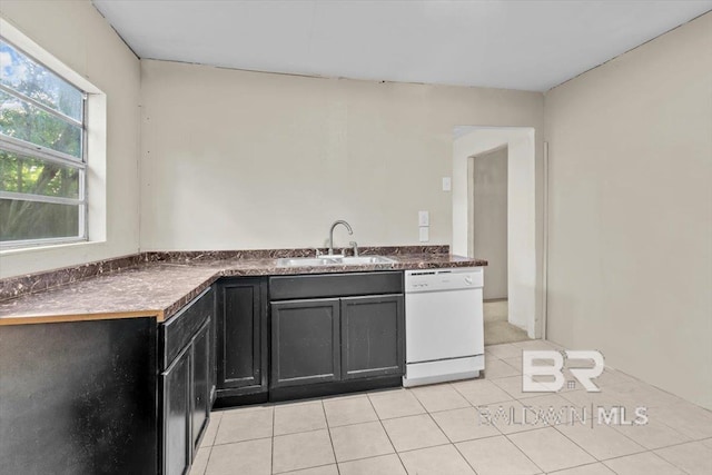 4918 Quimby Dr, Mobile, AL 36619 - kitchen with dishwasher, a sink, dark cabinets, light tile patterned floors, and dark countertops
