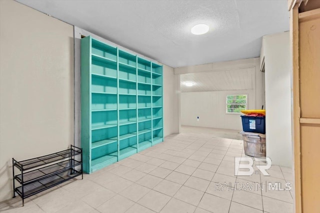 4918 Quimby Dr, Mobile, AL 36619 - empty room featuring a textured ceiling and tile patterned floors