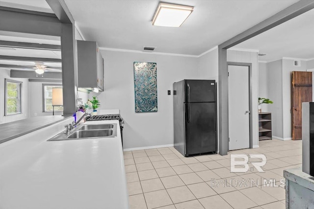 4918 Quimby Dr, Mobile, AL 36619 - kitchen featuring freestanding refrigerator, a sink, baseboards, light tile patterned flooring, and a ceiling fan
