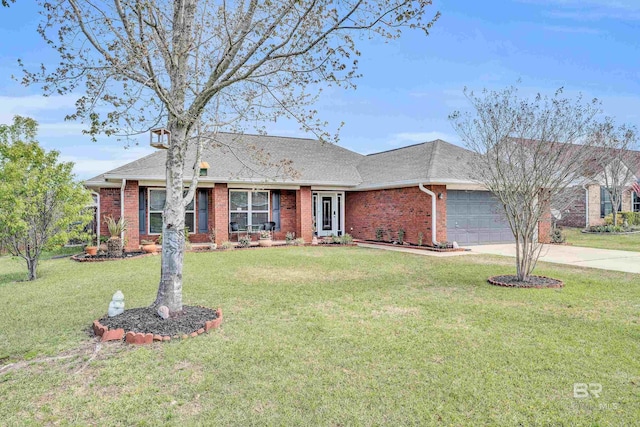 single story home featuring driveway, brick siding, an attached garage, and a front yard