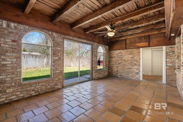 unfurnished sunroom with wooden ceiling, ceiling fan, and beam ceiling