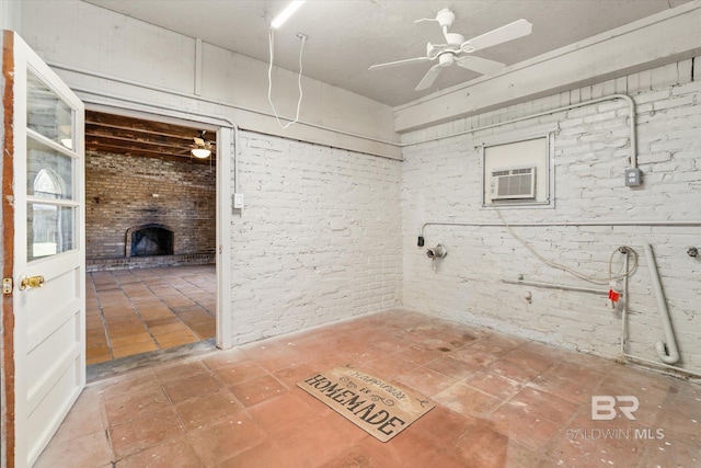 bathroom with brick wall, ceiling fan, and a brick fireplace