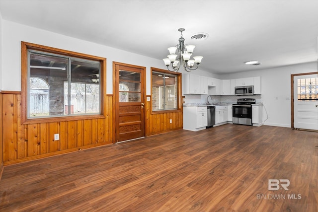 kitchen with visible vents, a chandelier, stainless steel appliances, light countertops, and white cabinetry