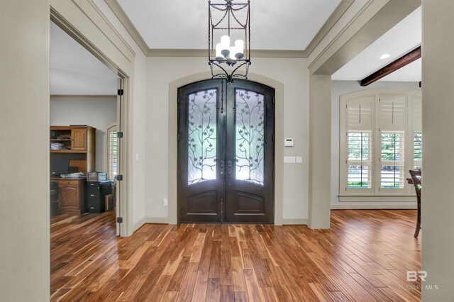 917 Rockaway Creek Rd, Atmore, AL 36502 - entryway with a notable chandelier, wood finished floors, french doors, and baseboards