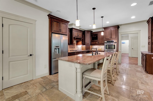 917 Rockaway Creek Rd, Atmore, AL 36502 - kitchen featuring light stone counters, decorative backsplash, a sink, appliances with stainless steel finishes, and stone tile flooring