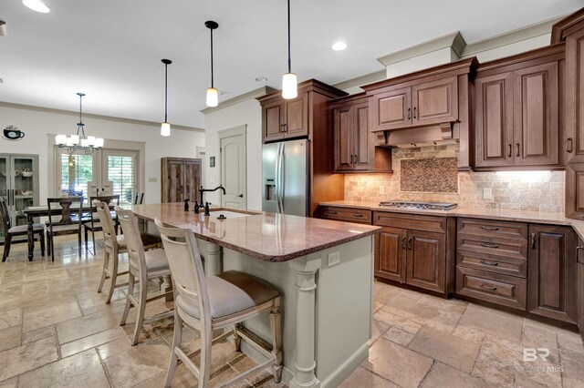 917 Rockaway Creek Rd, Atmore, AL 36502 - kitchen with light stone countertops, stainless steel appliances, stone tile flooring, and a sink