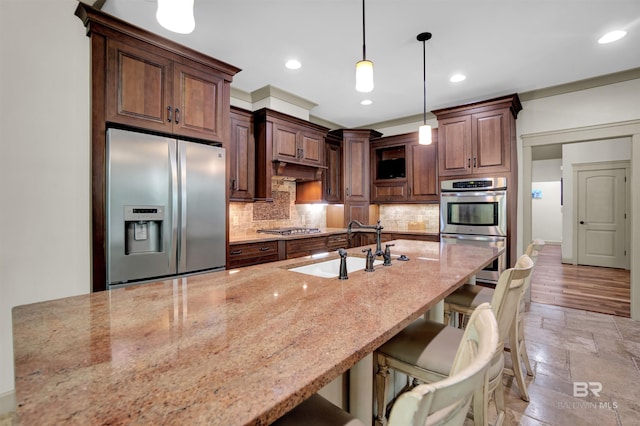 917 Rockaway Creek Rd, Atmore, AL 36502 - kitchen with light stone counters, decorative backsplash, a sink, stainless steel appliances, and recessed lighting