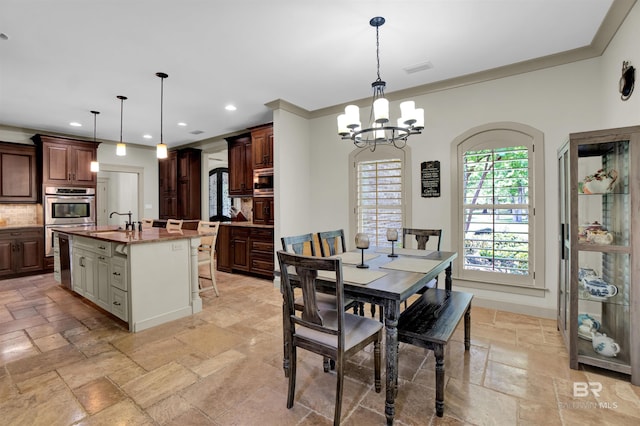 917 Rockaway Creek Rd, Atmore, AL 36502 - dining space with an inviting chandelier, stone tile floors, recessed lighting, and crown molding