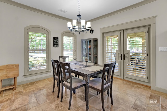 917 Rockaway Creek Rd, Atmore, AL 36502 - dining area with an inviting chandelier, stone tile floors, visible vents, baseboards, and french doors