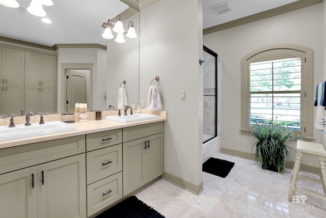 917 Rockaway Creek Rd, Atmore, AL 36502 - full bath with double vanity, a sink, enclosed tub / shower combo, and baseboards