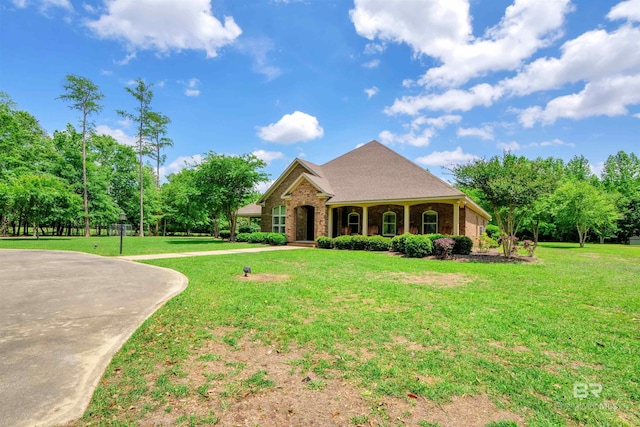 917 Rockaway Creek Rd, Atmore, AL 36502 - view of front facade with a front yard and brick siding