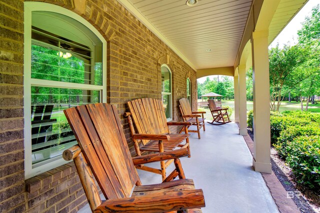 917 Rockaway Creek Rd, Atmore, AL 36502 - view of patio featuring covered porch