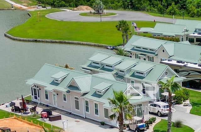 bird's eye view featuring a residential view and a water view