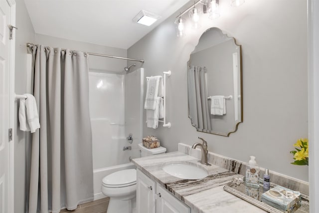 full bathroom with vanity, toilet, and shower / bath combo with shower curtain