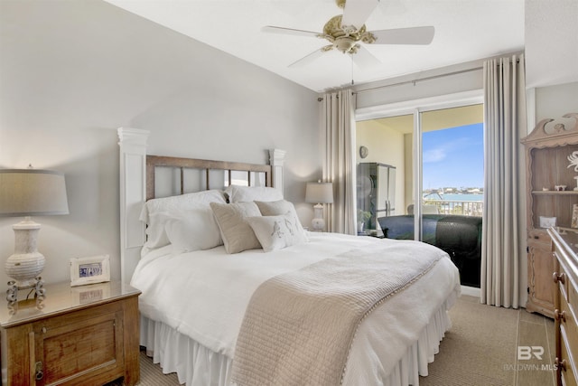 bedroom with access to exterior and ceiling fan