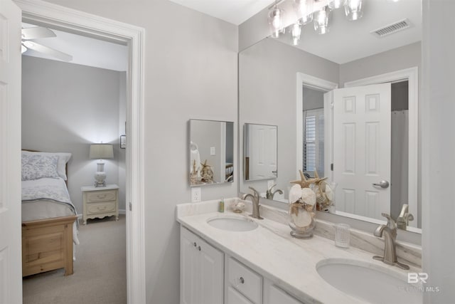 bathroom featuring ceiling fan and vanity