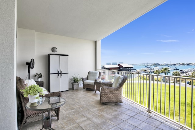 balcony featuring a water view