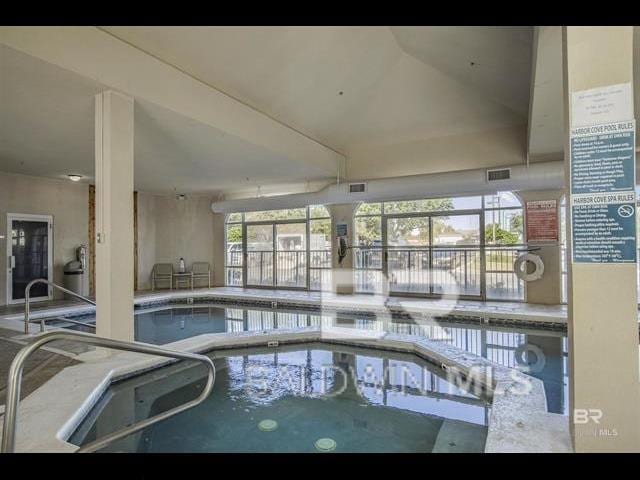 view of pool featuring an indoor hot tub