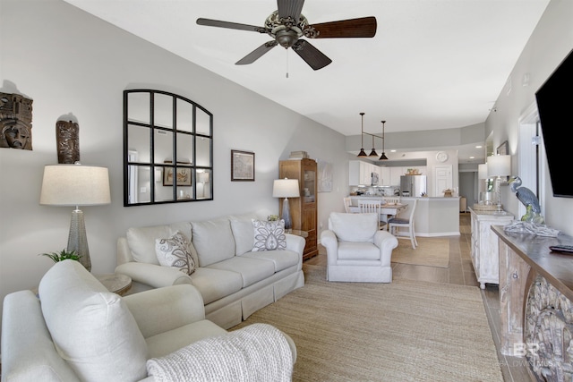 tiled living room with ceiling fan