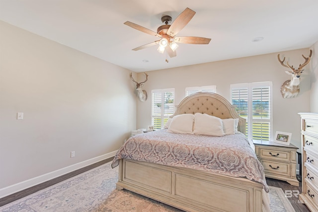 bedroom featuring wood-type flooring and ceiling fan