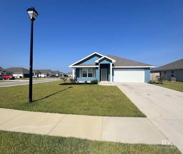 view of front facade featuring a front lawn and a garage