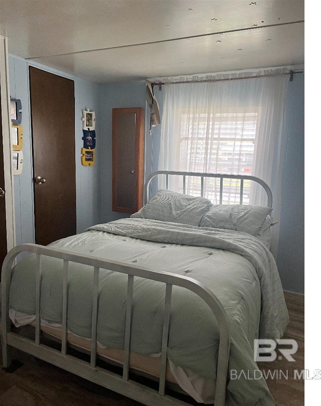 bedroom featuring hardwood / wood-style flooring