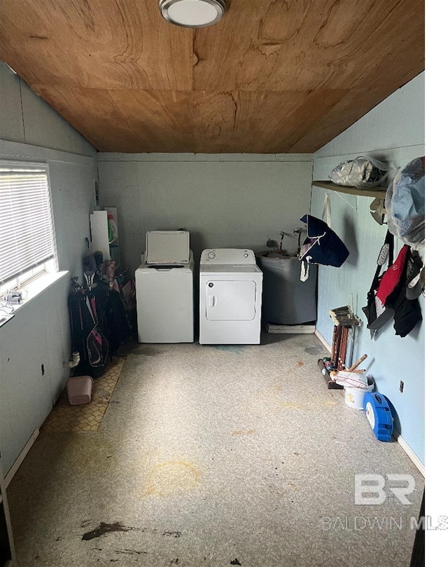 laundry area featuring washer and dryer, water heater, and wood ceiling