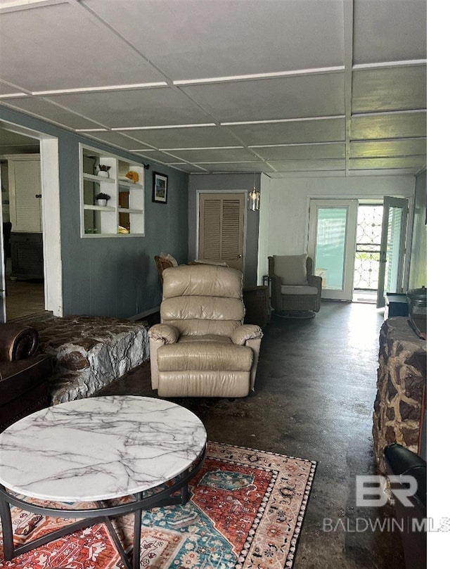 living room featuring built in shelves