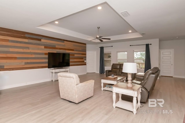 12927 Sanderling Loop, Spanish Fort, AL 36527 - living room with a raised ceiling, wood finished floors, ceiling fan, wood walls, and recessed lighting