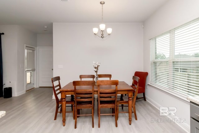 12927 Sanderling Loop, Spanish Fort, AL 36527 - dining room featuring a chandelier and light wood-style floors