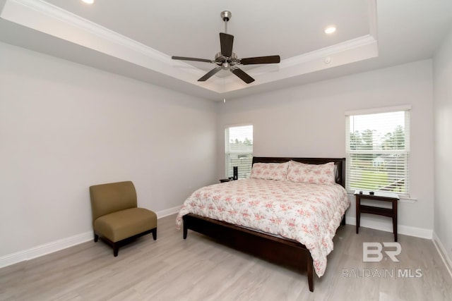12927 Sanderling Loop, Spanish Fort, AL 36527 - bedroom featuring a tray ceiling, light wood-style flooring, recessed lighting, ornamental molding, and a ceiling fan