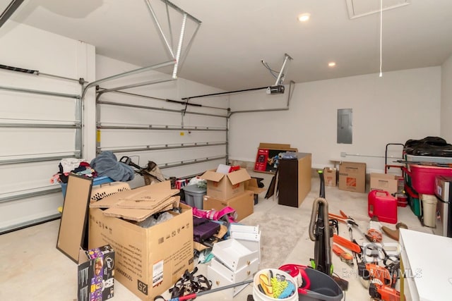 12927 Sanderling Loop, Spanish Fort, AL 36527 - garage featuring a garage door opener, electric panel, and recessed lighting