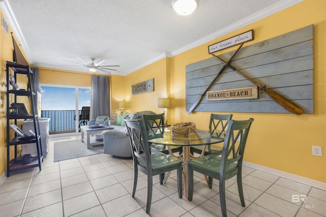 26750 Perdido Beach Blvd Unit 708, Orange Beach, AL 36561 - tiled dining space featuring a textured ceiling, ornamental molding, and a ceiling fan