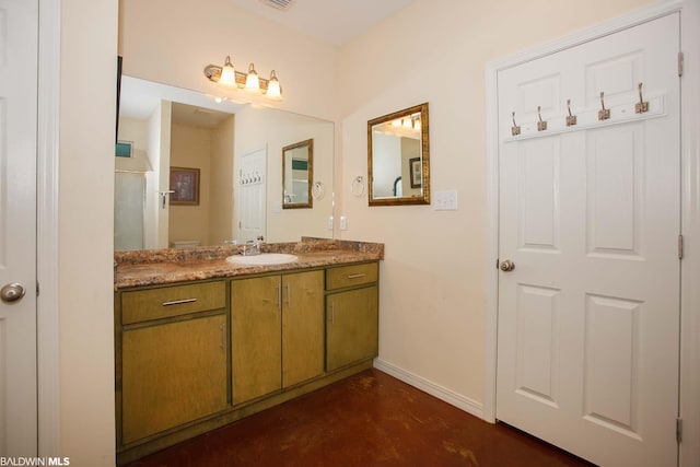 bathroom with concrete flooring and large vanity