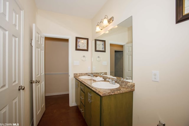 bathroom with large vanity and double sink