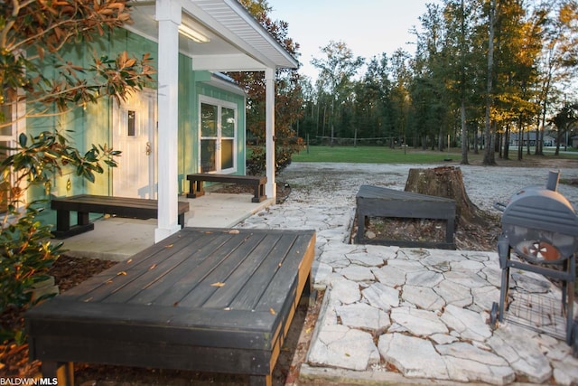 wooden deck featuring a patio and grilling area