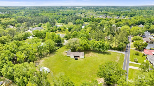 aerial view featuring a wooded view