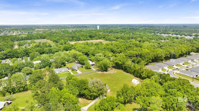 birds eye view of property with a forest view and a residential view