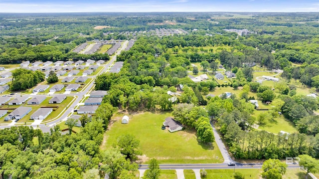 drone / aerial view with a view of trees