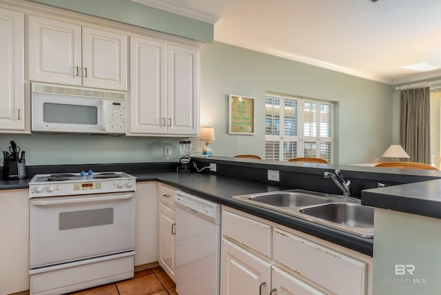 kitchen with ornamental molding, white appliances, sink, and light tile floors