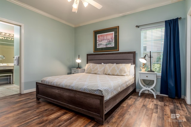 bedroom with dark wood-type flooring, connected bathroom, ceiling fan, and crown molding