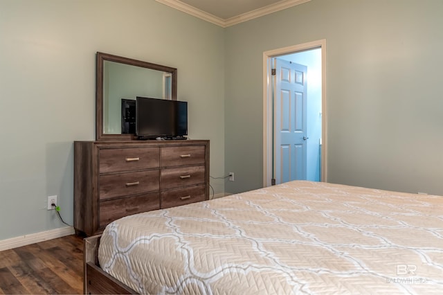 bedroom with ornamental molding and dark wood-type flooring