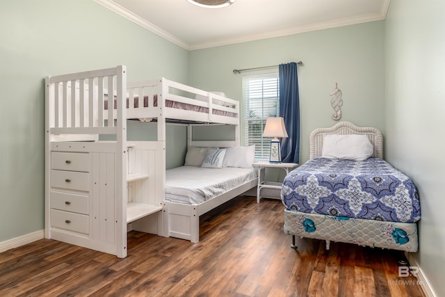 bedroom with dark hardwood / wood-style floors and crown molding