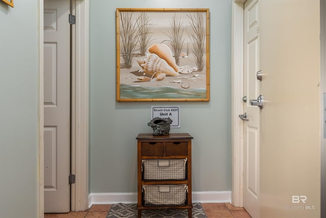 hallway with tile floors