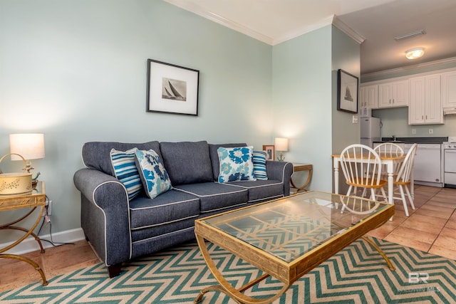 living room with tile flooring and ornamental molding