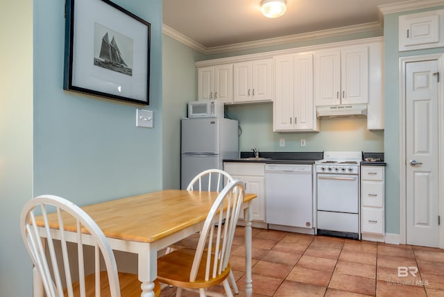 kitchen featuring light tile flooring, crown molding, white cabinetry, sink, and white appliances