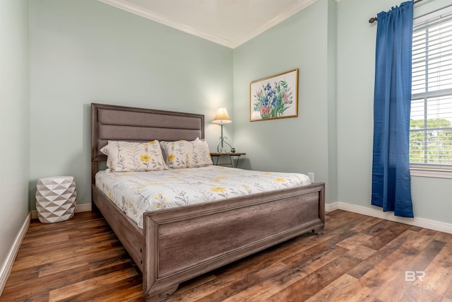 bedroom with ornamental molding and dark wood-type flooring