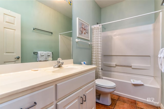 full bathroom featuring tile flooring, shower / tub combo with curtain, toilet, and large vanity