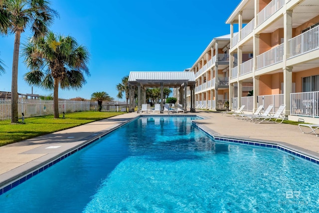 view of swimming pool with a patio