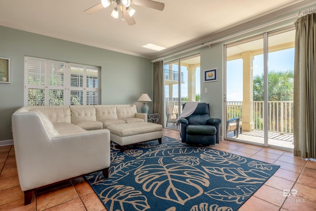 tiled living room featuring crown molding, a wealth of natural light, and ceiling fan